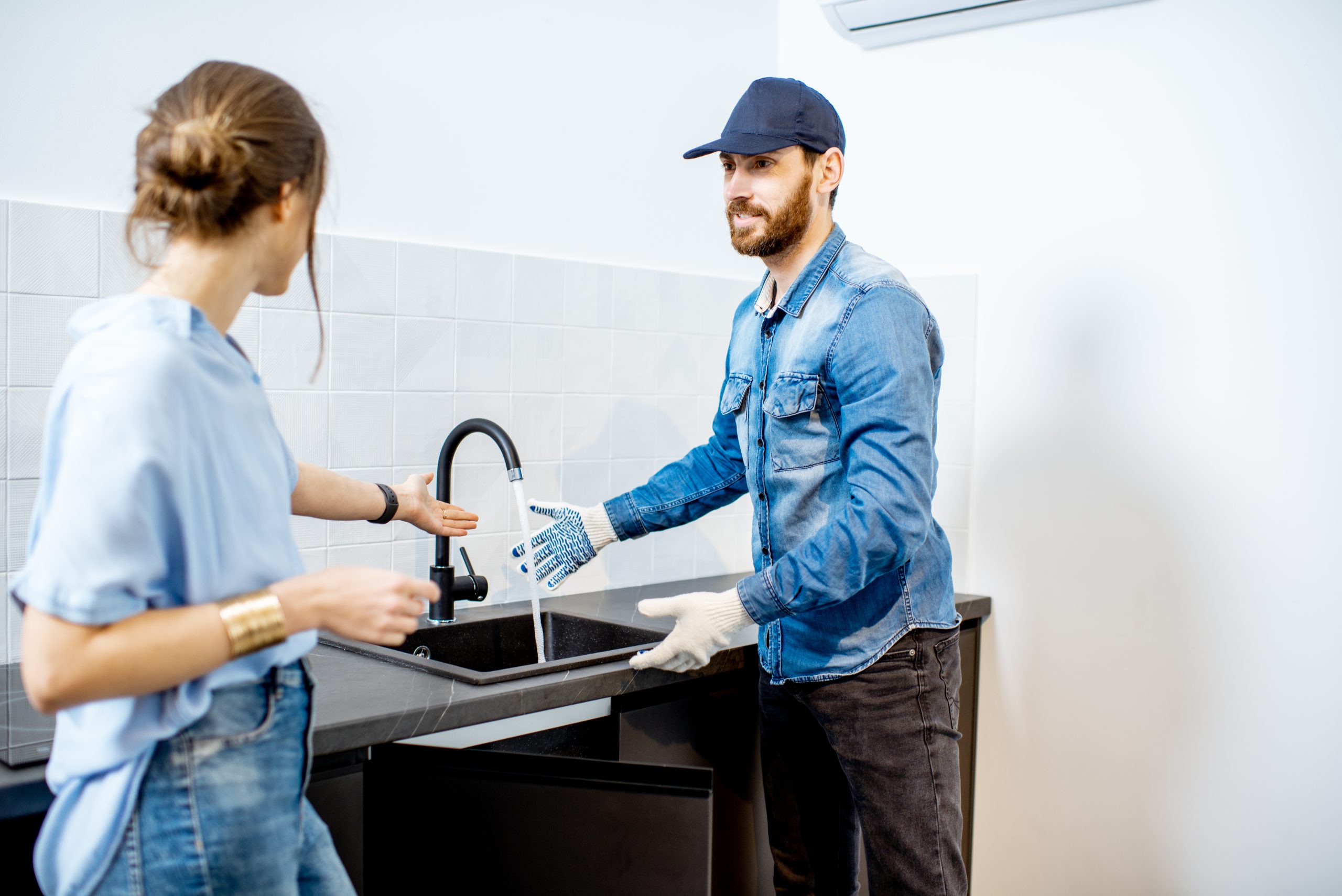 handy man with woman on the kitchen